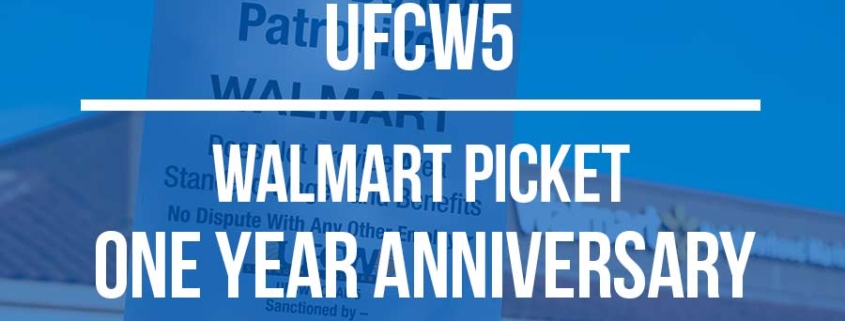 Walmart picket one-year anniversary banner